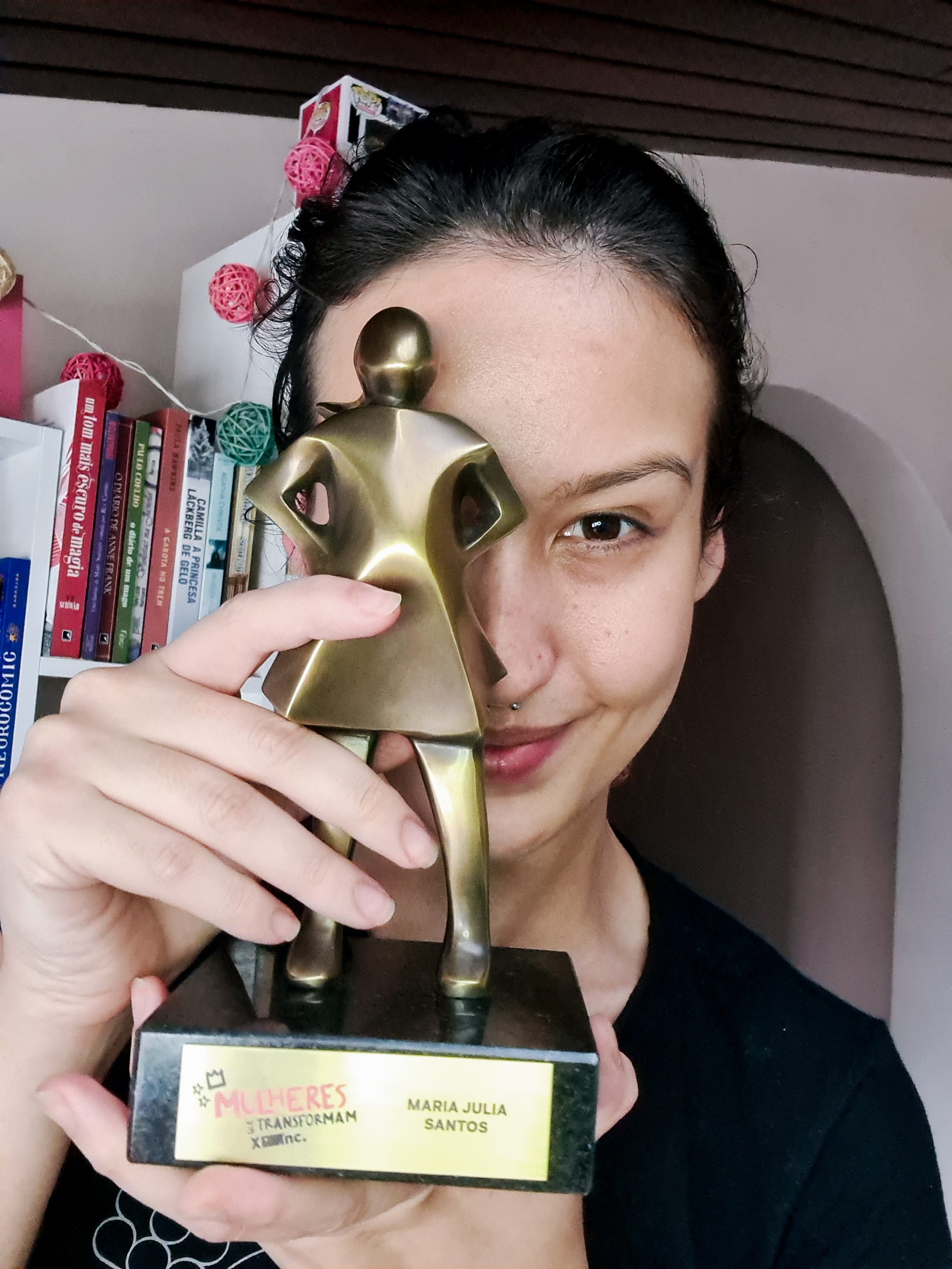 Maju holding a trophy